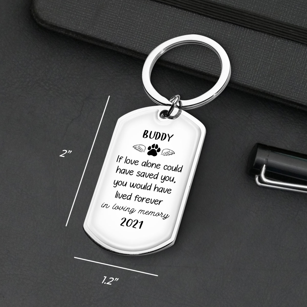 Stainless steel pet memorial keychain with engraved quote and paw print, lasting memory gift.