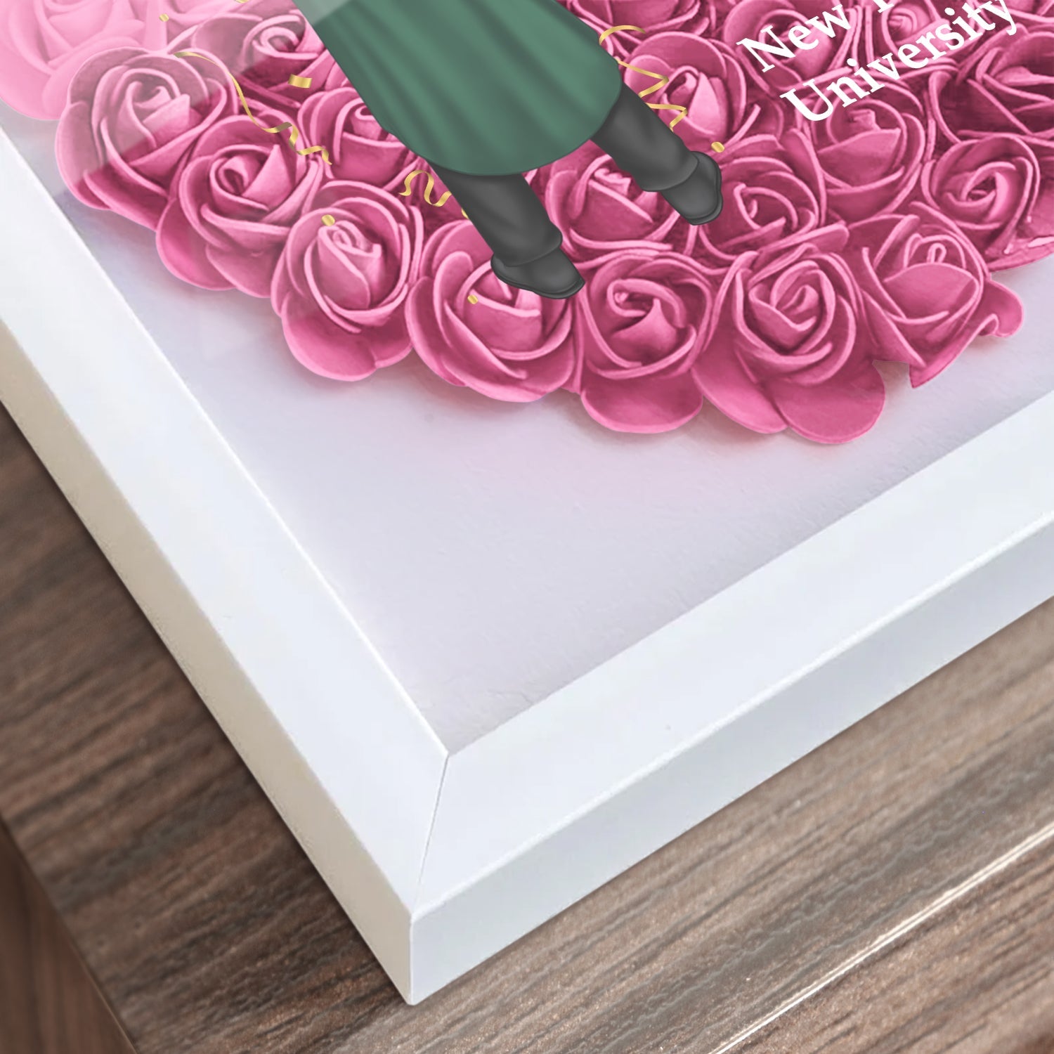 Heart-shaped graduation gift flower shadow box with pink roses and white frame, perfect graduation gift.