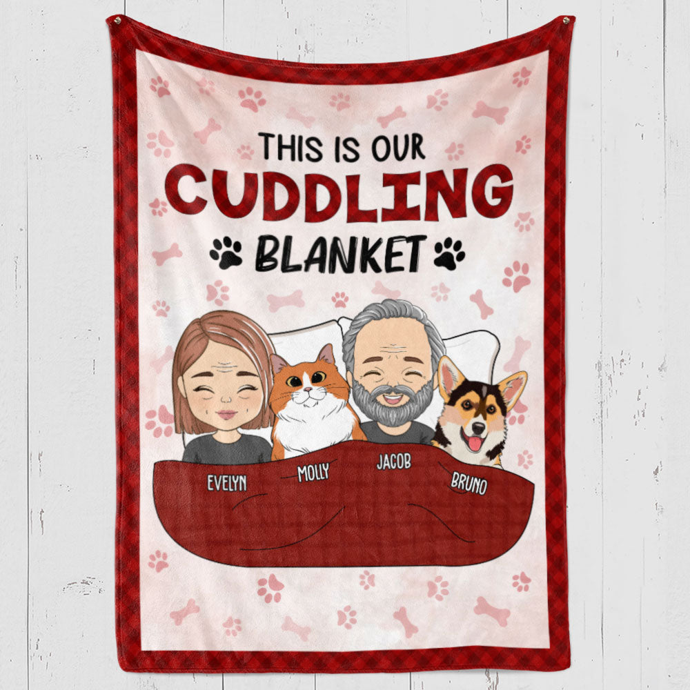 Custom Fleece Blanket featuring a cuddling couple and a dog, with the text "This is our cuddling blanket".