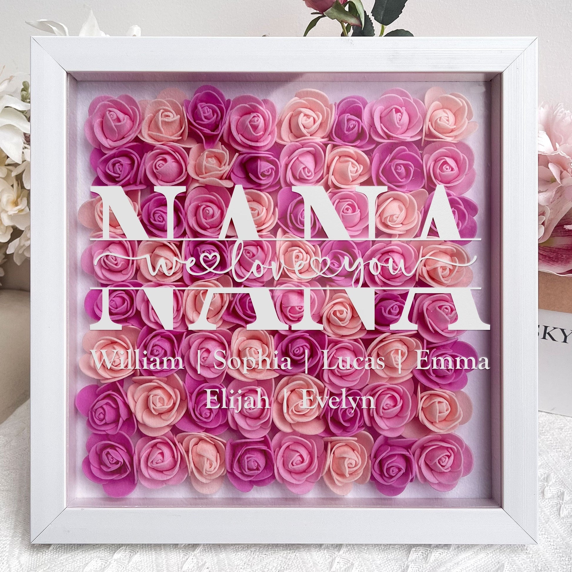 Personalized flower shadow box for Mom with names. White MDF frame, We Love You, perfect Mother's Day gift.