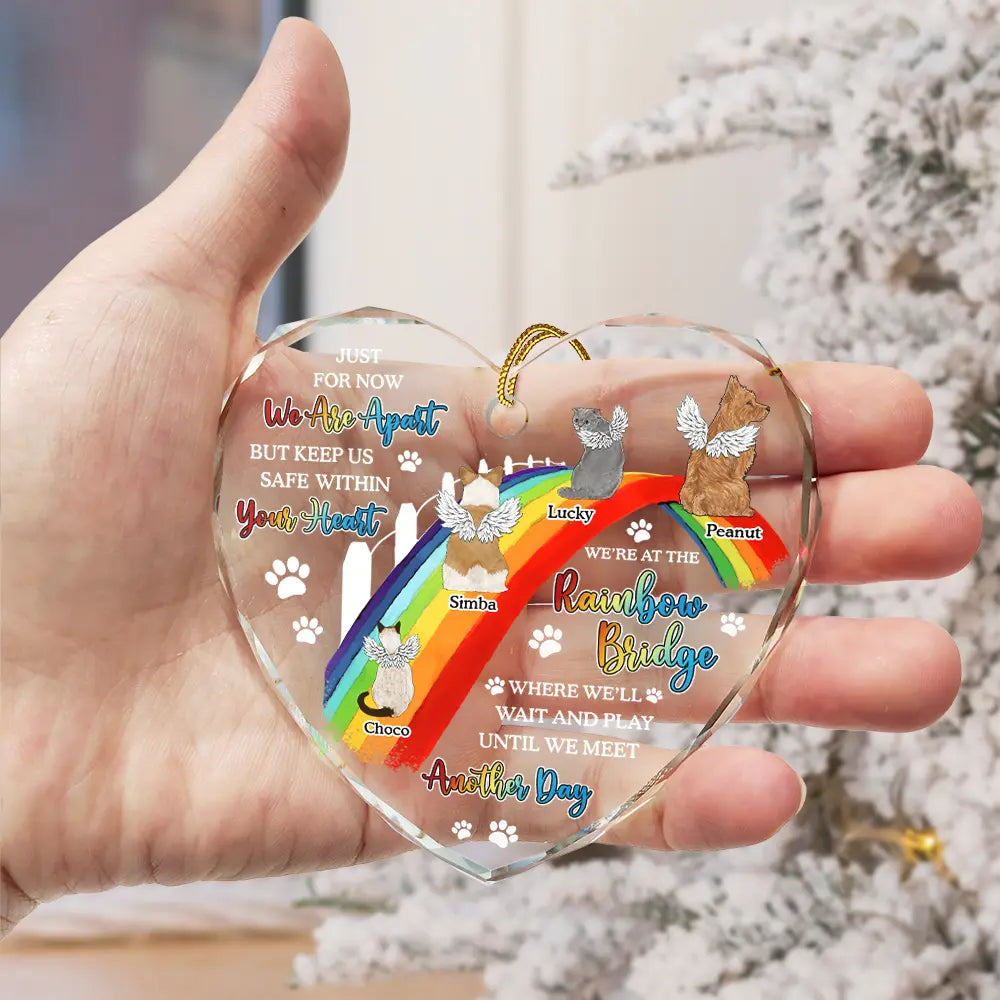 Heart-shaped pet memorial ornament with rainbow bridge design. Glass keepsake for dog or cat loss.