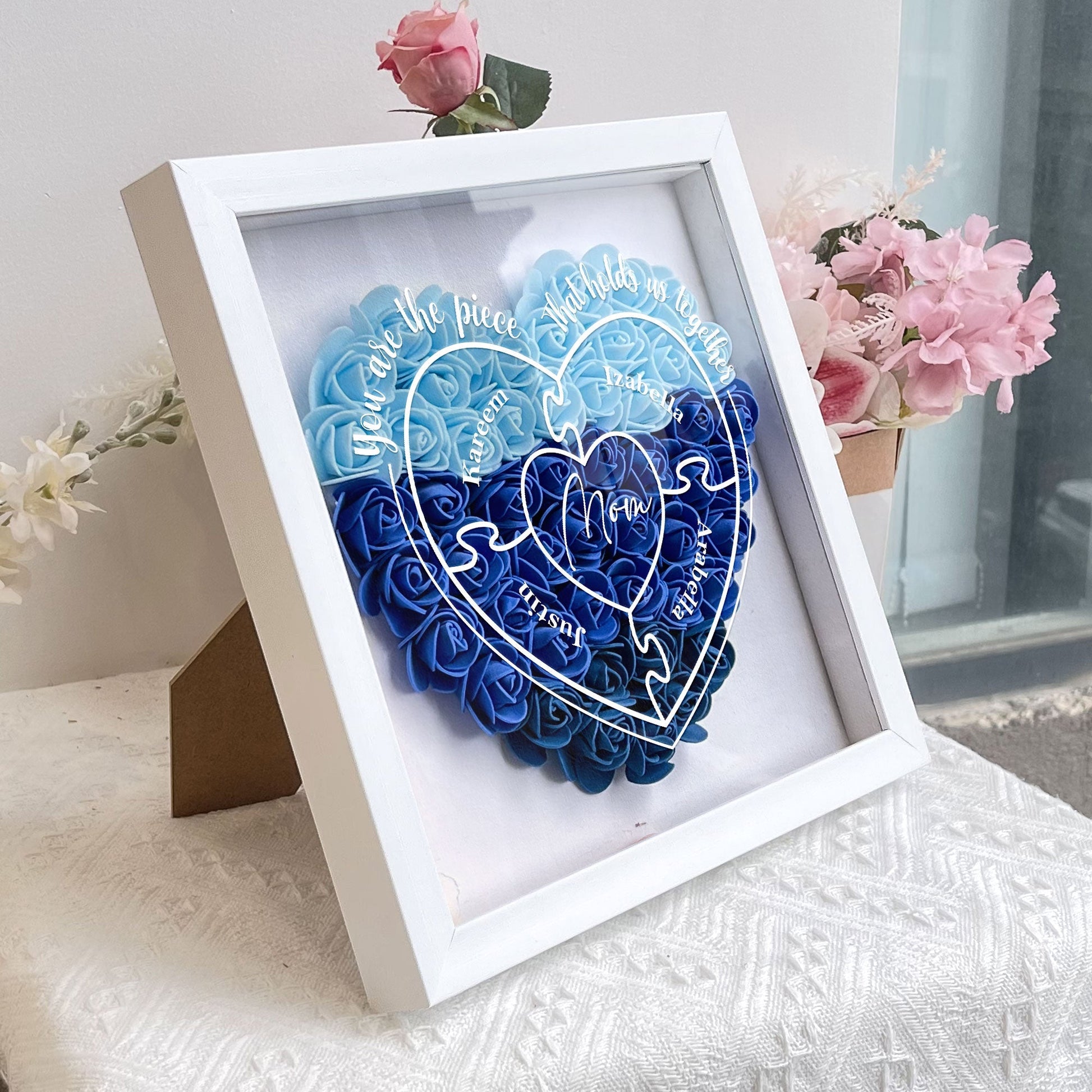 Mom flower shadow box gift with "You Are The Piece That Hold Us Together" design, blue floral heart.