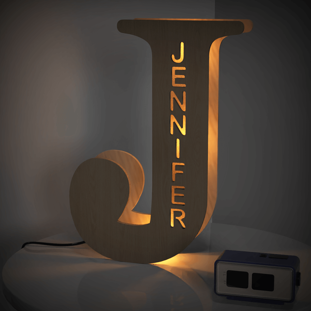 Personalized wooden letter 'J' night light with 'JENNIFER' name, warm LED glow, 28cm home decor.